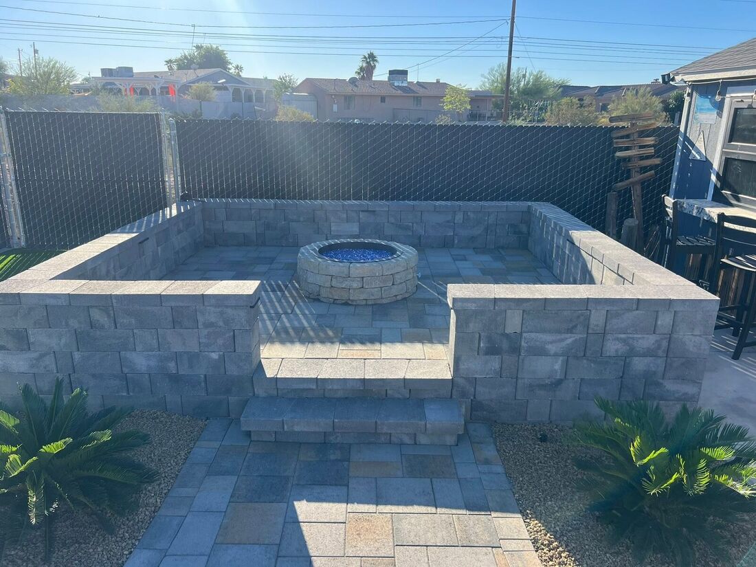 Retaining Walls project by Havasu Pavers in Lake Havasu City — Block fire pit and seat wall in a backyard build